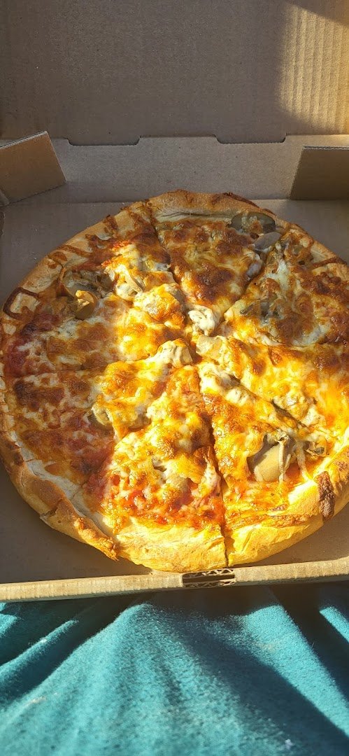 Pizza slices on a restaurant table.