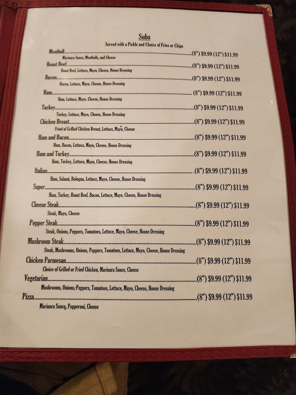 Printed pizza menu with specialty options.